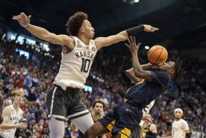 No. 3 Kansas uses defense, 3-pointers to hold off West Virginia